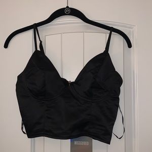 Black tank crop top. Zipper detail in back. Never worn.